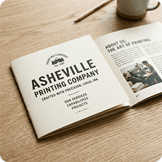 Open booklet on a wooden desk